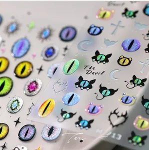 Macro shot of M-713 devil eye nail art stickers with aurora shimmer and 3D texture