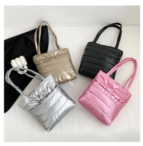Quilted metallic padded tote bags in silver, gold, black, and pink colors for women