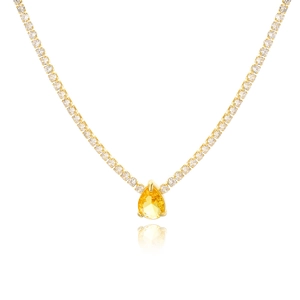 Detailed view of gold plated tennis necklace featuring a pear-cut yellow zircon pendant