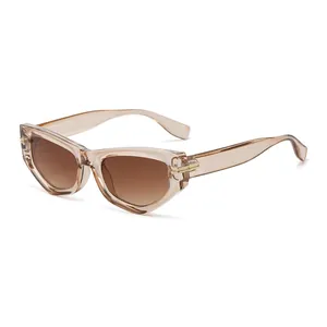 Retro champagne cat-eye sunglasses with brown gradient lenses and golden metal accents