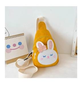 Close-up of yellow canvas bunny chest bag for kids with white zipper and adjustable strap