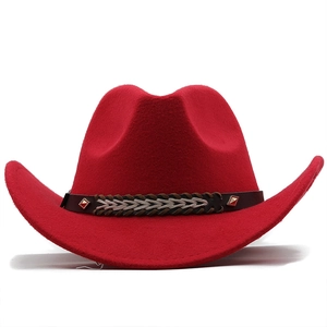 Detail view of red wool cowboy hat featuring dark decorative band with metallic rivets