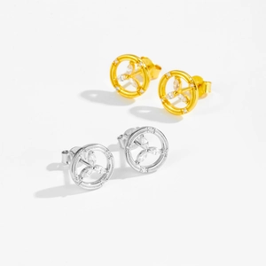 Detail shot of hollow round 925 silver earrings with flower patterns and clear zircon stones