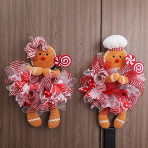 Gingerbread man Christmas wreath decorations with chef hat and mesh skirt on wood