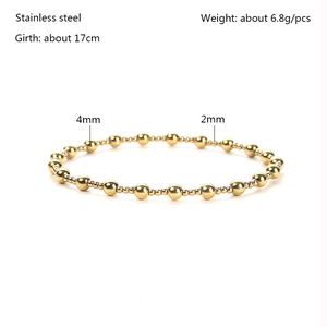 Detail of 18K gold stainless steel beaded bracelet showing 2mm and 4mm beads sizes