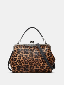 Detail of leopard print faux leather handbag with vintage metal clasp and black handle