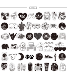 Flat lay of 50 black and white street graffiti stickers for luggage and laptops