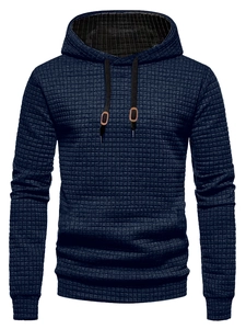 Detail shot of navy blue waffle texture fabric and drawstring on men's hoodie
