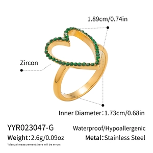 Detailed view of gold stainless steel heart ring with green zircon and size measurements