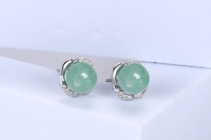 Close-up of S925 silver stud earrings with round green aventurine and sparkling crystals
