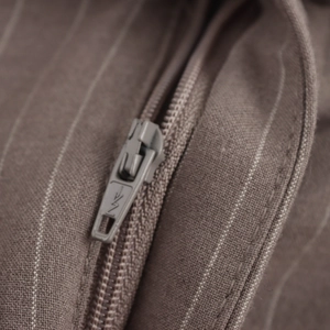 Brown striped straight-leg trousers with high-quality YKK metal zipper detail and fine stitching
