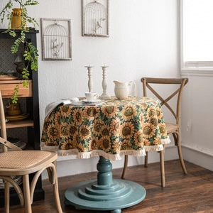 American style round sunflower jacquard tablecloth with tassel fringe on a wooden table