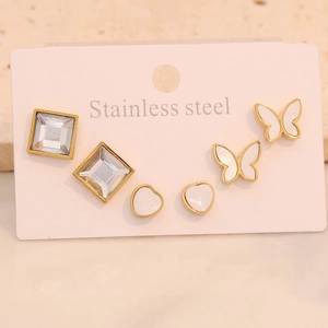 Detailed set of golden stainless steel studs featuring crystal, heart and butterfly motifs
