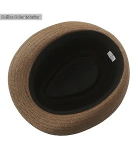 Detail view of coffee straw fedora interior with sweatband and 100% paper material label