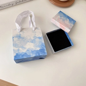 Blue cloud jewelry gift box and matching paper carry bag with white ribbon handle
