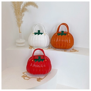 Detail view of pumpkin-shaped bags with shiny finish and leaf accents in three colors