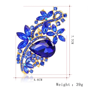 Blue crystal floral brooch with gold base, pear-shaped center stone, 7.7cm x 4.6cm size