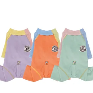 Three-color patchwork dog jumpsuits with Vitalitydog embroidery in purple, orange, and mint