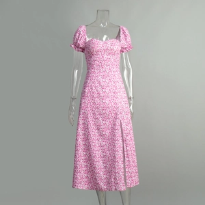 Detail of pink floral dress featuring puff sleeves, sweetheart neckline and high side slit