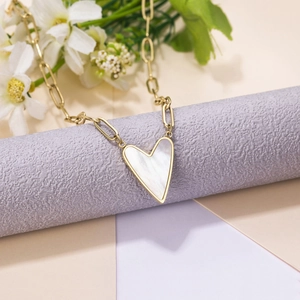 Elegant gold titanium steel necklace with white heart pendant on minimalist chain