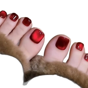 Glossy burgundy cat-eye square fake toenails with a mirror finish on faux fur