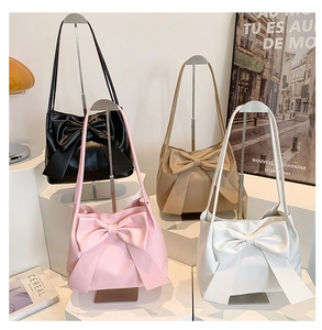 Chic shoulder bags in black, pink, beige and white with large decorative bow details