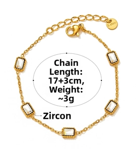 Macro detail of a gold stainless steel bracelet with five rectangular zircon stones
