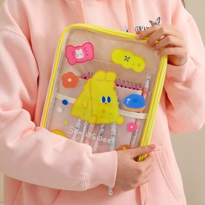 Detail of yellow transparent PVC 11-inch iPad sleeve showing inner mesh and cute tiger design