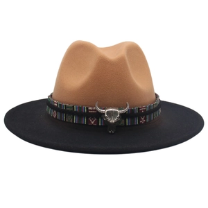 Two-tone western cowboy hat in camel and black wool felt with a metal bull head decor