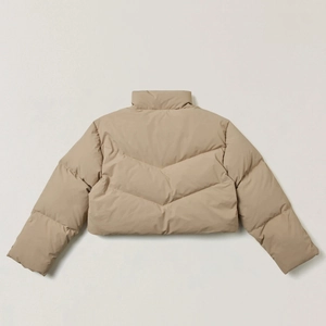 Detail of khaki cropped puffer jacket featuring V-shaped quilting and stand collar