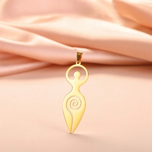 Detailed macro view of gold-plated goddess pendant on elegant pink silk fabric