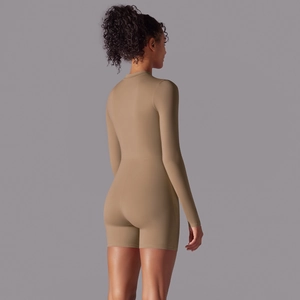 Back view of high-stretch long sleeve yoga bodysuit in earth tone with clean cut design