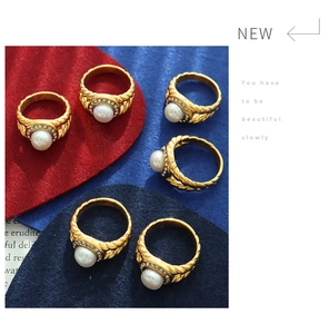 Detail of 18K gold plated rope ring with large freshwater pearl and zircon halo