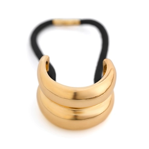 Detail of a minimalist gold geometric metal hair cuff with a durable black elastic band
