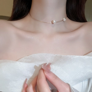 Chic gold neck collar with double white pearls worn on neck to show detail and fit