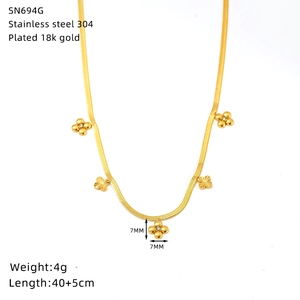 Detail of 18K gold plated clover pendants on a 304 stainless steel snake chain