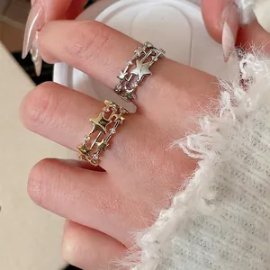 Three-layer star open ring with sparkling cubic zirconia in gold and silver finish