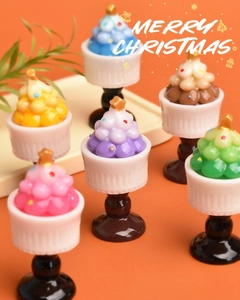Miniature resin Christmas trees in six colors with gold stars and festive dot details