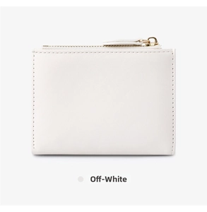 Detailed close-up of a minimalist off-white leather short wallet with a gold zipper closure