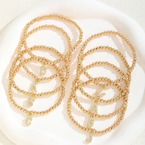Golden beaded stretch bracelets with zircon alphabet pendants A B D G J K M S