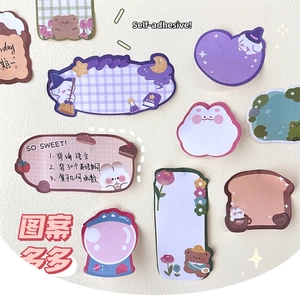 Close-up of cute cartoon heart and bunny shaped self-adhesive sticky note set for journaling