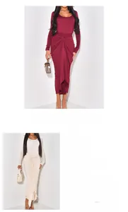 Detail view showing knot waist and pleated texture of this elegant slim fit maxi dress
