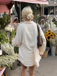 Beige oversized double gauze cotton shirt set for women in outdoor floral market scene