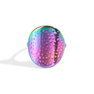 Detail of colorful oval stainless steel ring featuring a textured water drop surface