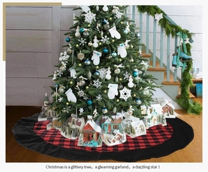 Classic red and black plaid Christmas tree skirt detail in a cozy holiday home setting