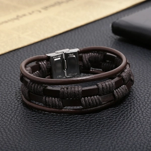 Detail of multi-layer brown braided leather bracelet with stainless steel magnetic clasp