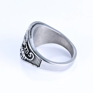 Detailed side view of vintage silver scorpion ring with embossed texture and dark finish