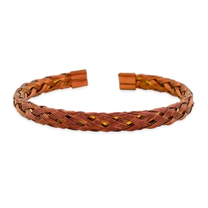 Macro shot of red-brown twisted wire mesh weave on stainless steel cuff bracelet