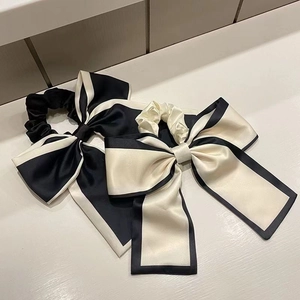 Elegant oversized satin bow hair scrunchies with long ribbons in black and beige cream