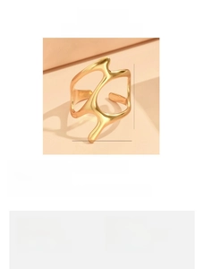 Detailed view of golden irregular geometric open ring with sizing and material specs